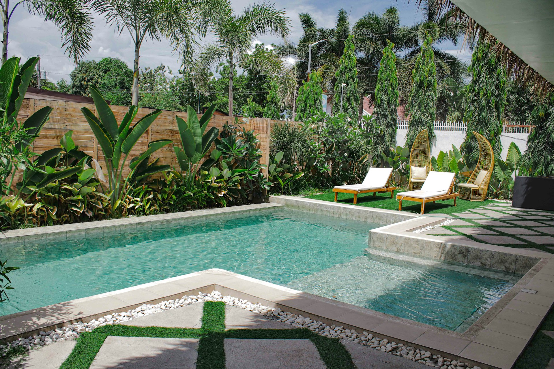 a pool with chairs around it
